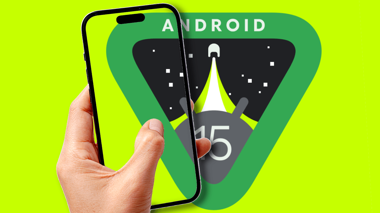 android 15 logo pictured in the background with a hand holding a smartphone seen in the foreground