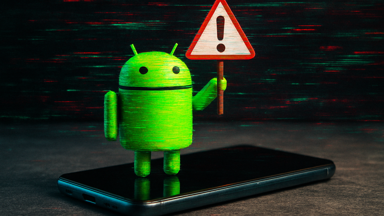 Android icon holds up alert sign while standing on top of Android phone
