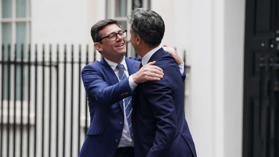 Andy Burnham and Ed Miliband on Downing Street