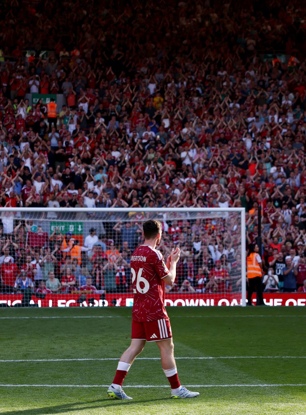 Andy Robertson applauds the Liverpool fans for the last time