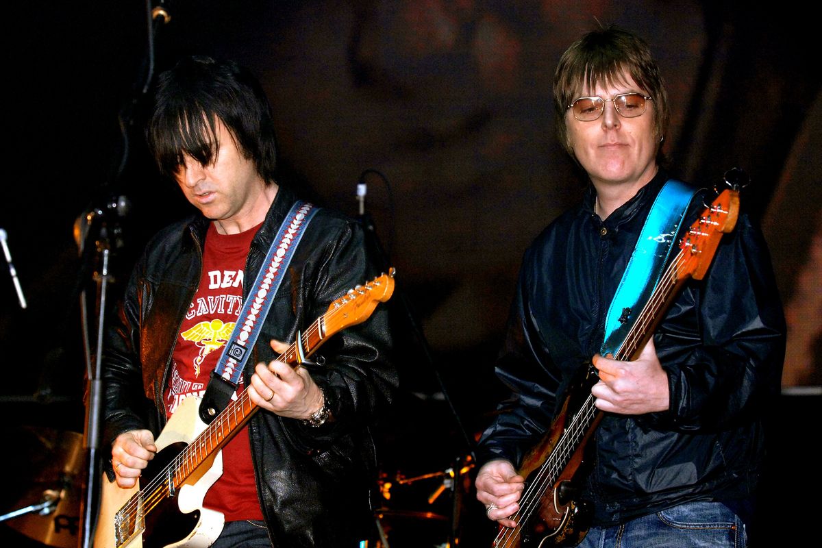 Andy Rourke (right) and Johnny Marr, on stage during the 'Manchester Versus Cancer' charity concert