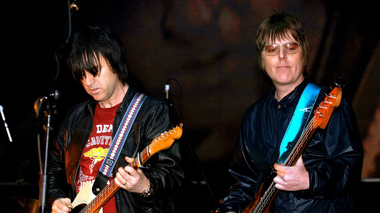 Andy Rourke (right) and Johnny Marr, on stage during the 'Manchester Versus Cancer' charity concert