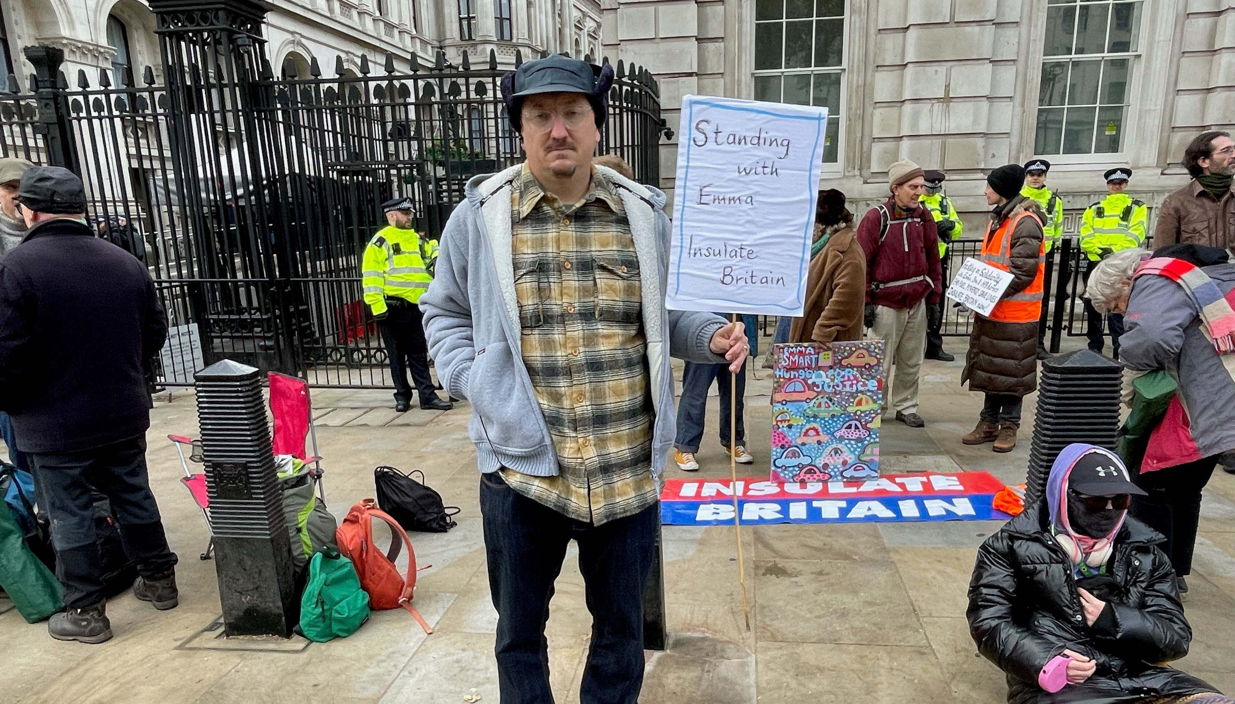 Andy Smith who is fasting in solidarity with his wife, Emma Smart, who is on hunger strike in prison, with supporters of Insulate Britain staging a 24 hour fast outside Downing Street, London, in a call for action on fuel poverty. Picture date: Tuesday November 30, 2021.