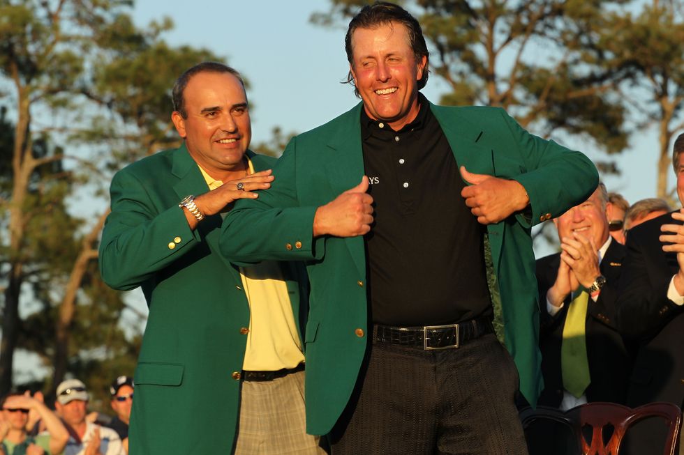 Angel Cabrera handing over the Masters jacket to Phil Mickelson in 2010