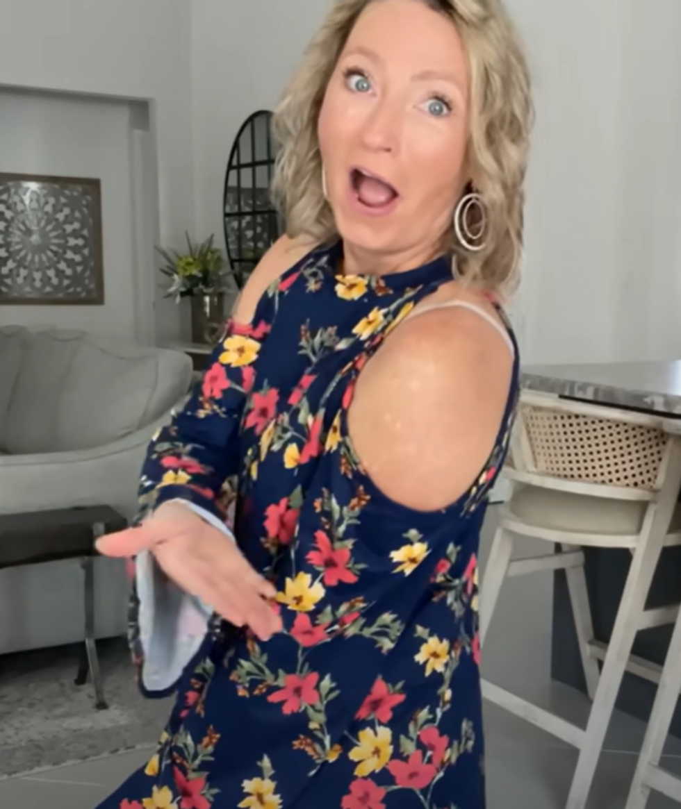 Angela Masson wearing a cold shoulder top