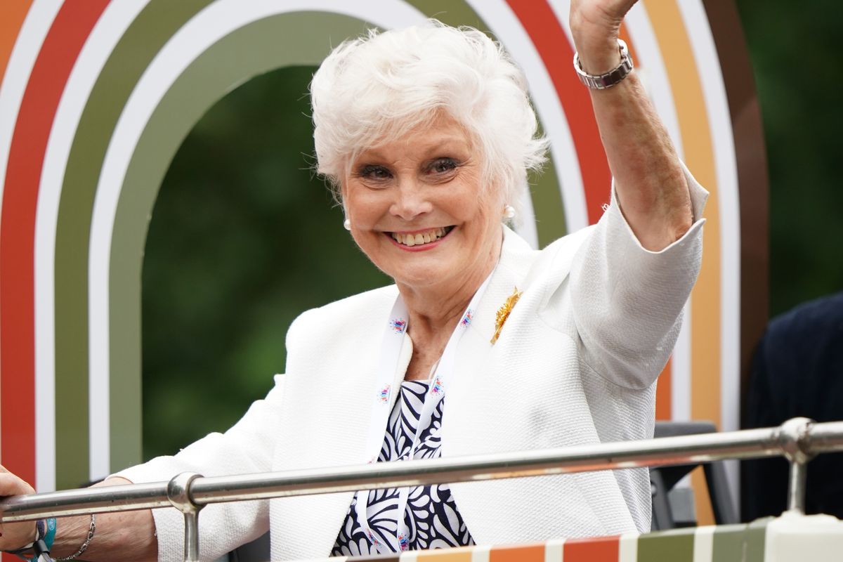 angela Rippon waves