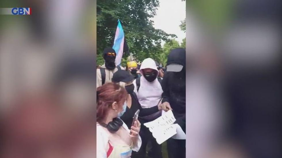 Trans activists clad in balaclavas barricade women's rights campaigners into pub and call them 'fascists'
