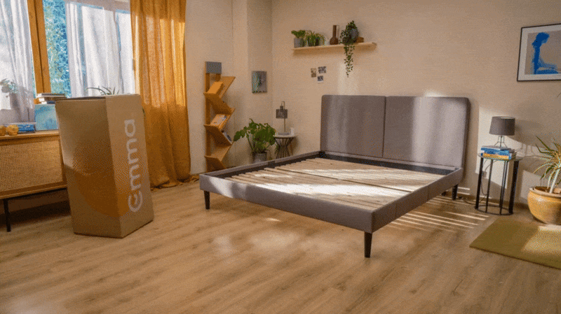 animated gif of a bed in a box mattress expanding into place on a bedframe