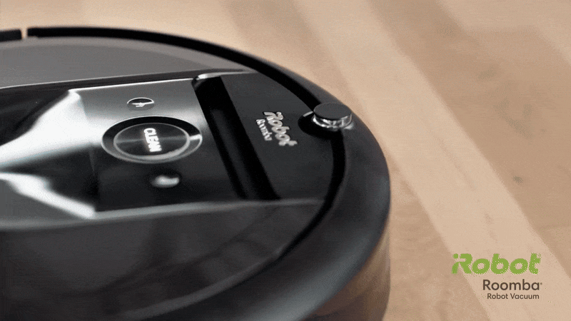 animated gif showing the irobot roomba vacuum cleaner cleaning a floor and then lifting itself into a carpet