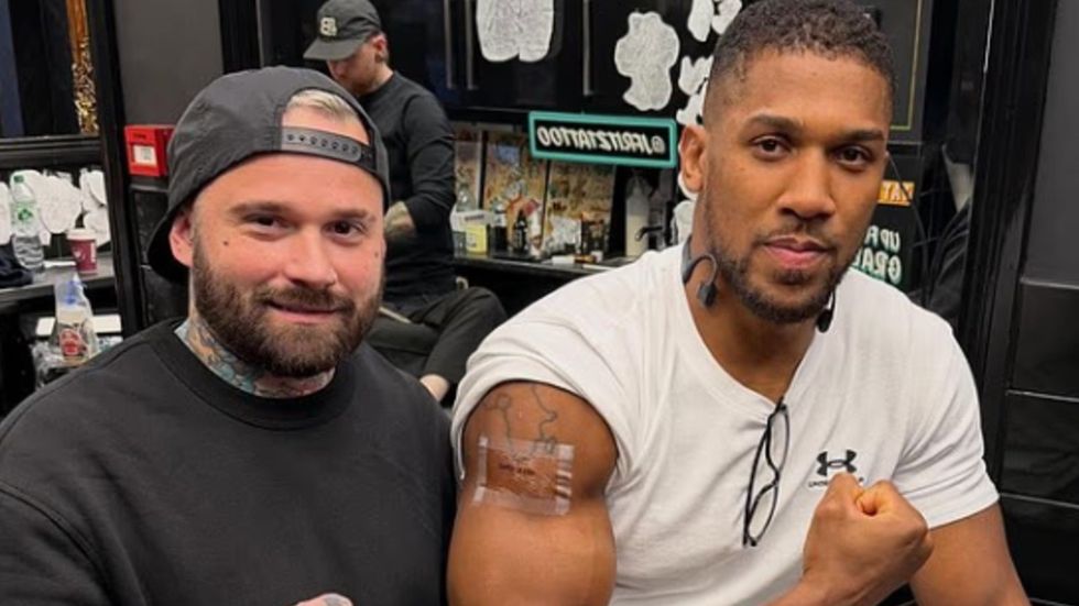 Anthony Joshua has honoured two close friends who lost their lives in a devastating road accident by permanently inking their names onto his arm