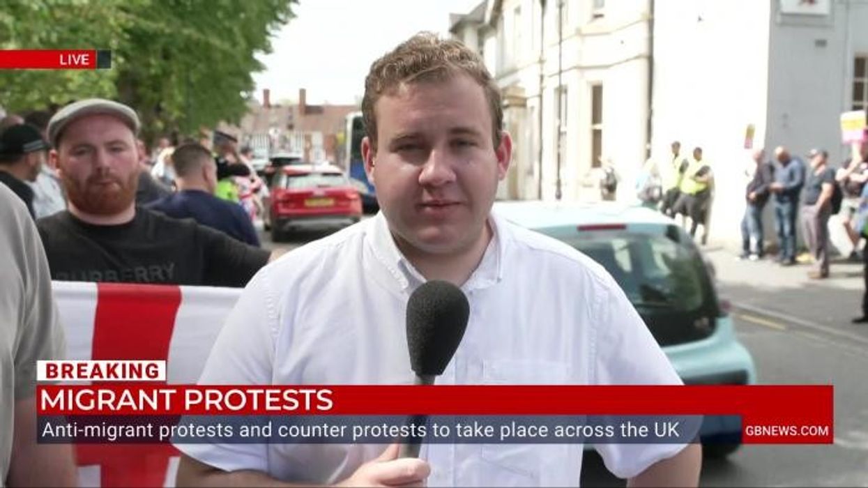 Police launch probe after officer told anti-migrant protester 'it's a load of b******s' while giving warning over rally
