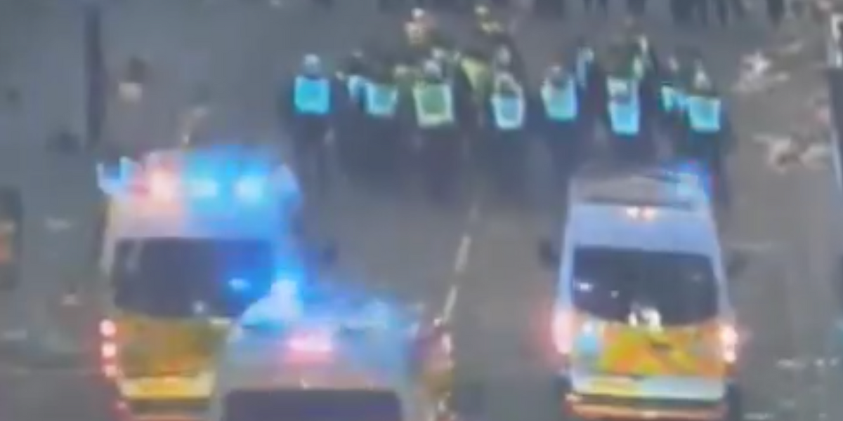 NextImg:Dozens of anti-social yobs throw bottles at police officers with intention of fuelling 'disruption and disorder'