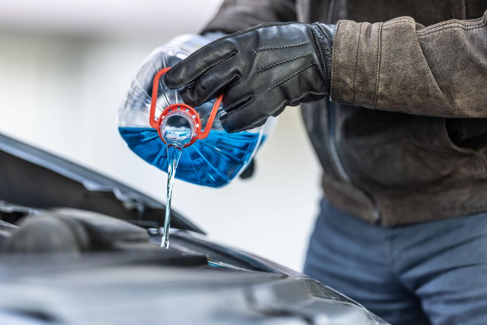 Antifreeze being added to car