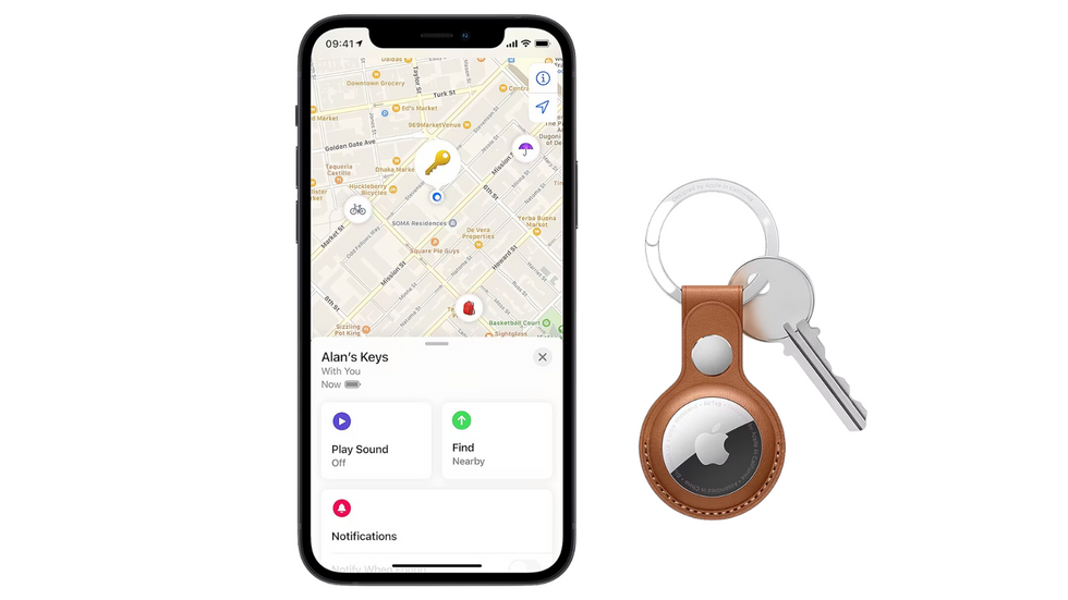 apple airtag pictured attached to keys next to an iphone using the find my app on a white background