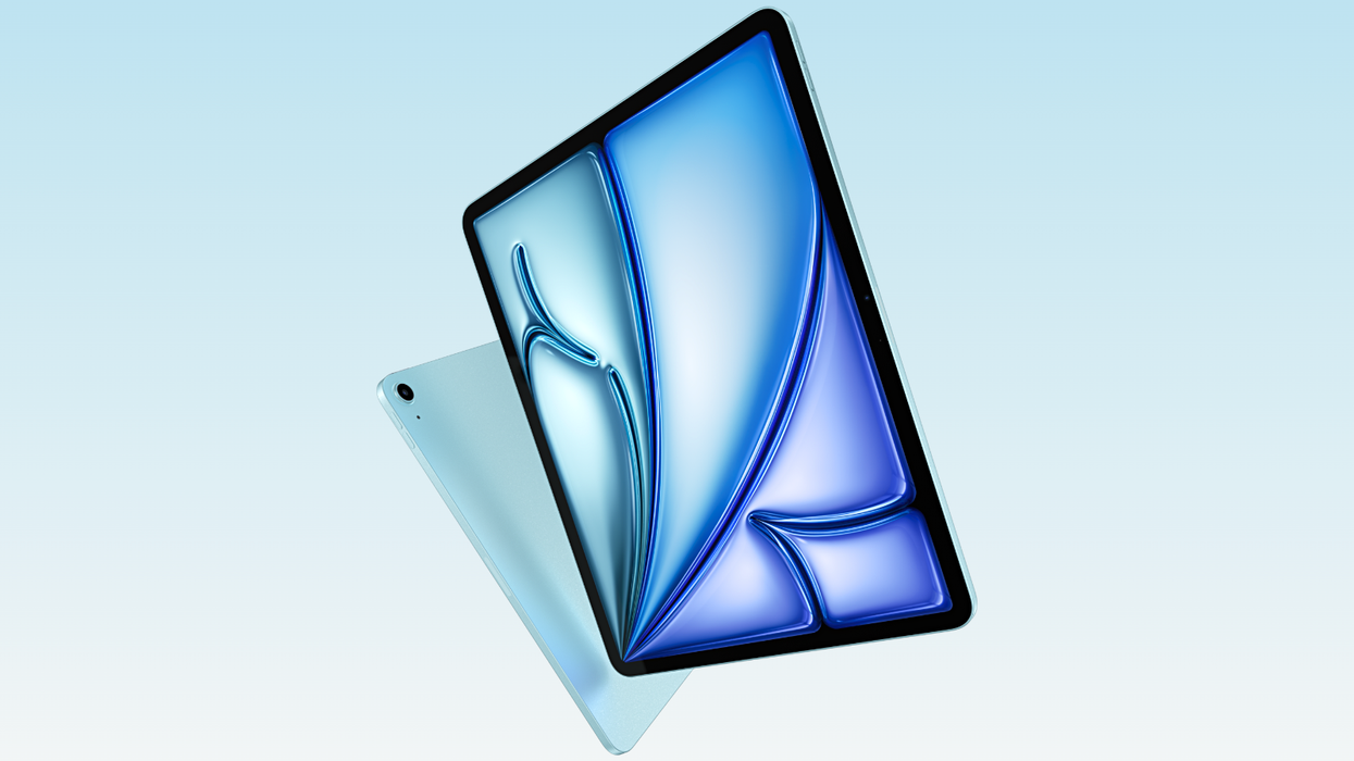 apple ipad air on a blue background in the blue finish and new iPadOS wallpaper