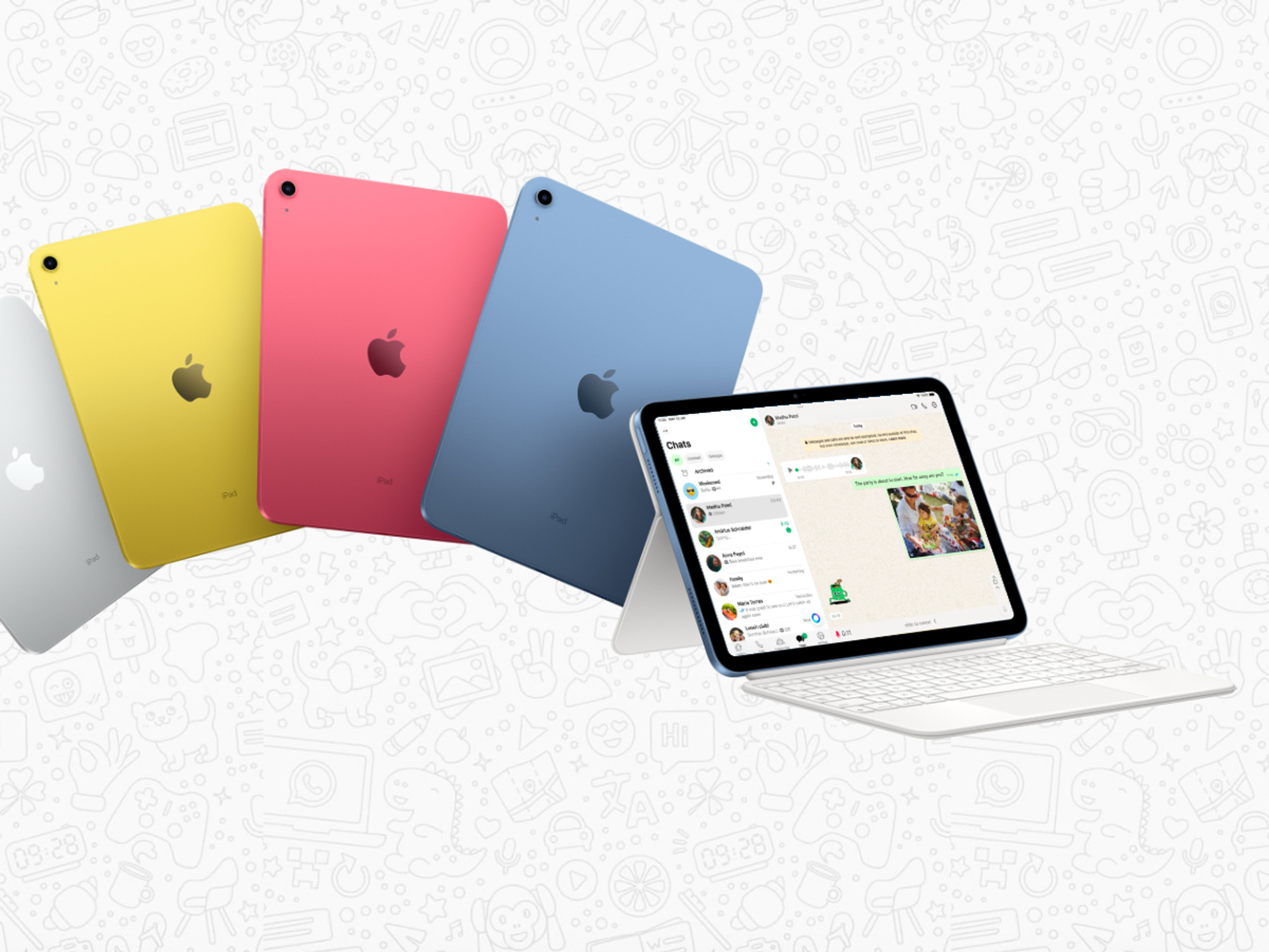 apple ipad shown in four colours with the new whatsapp app on screen