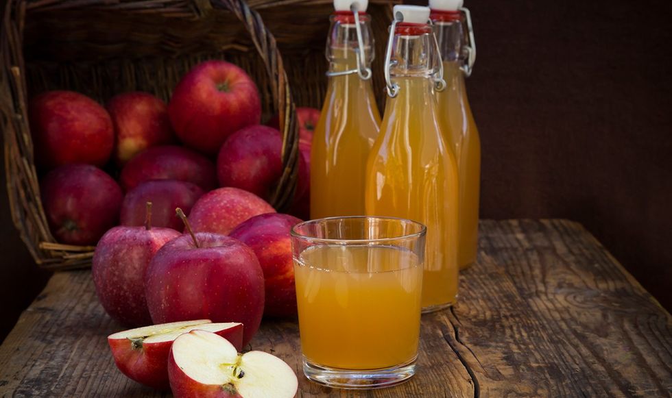 Apple juice next to apples