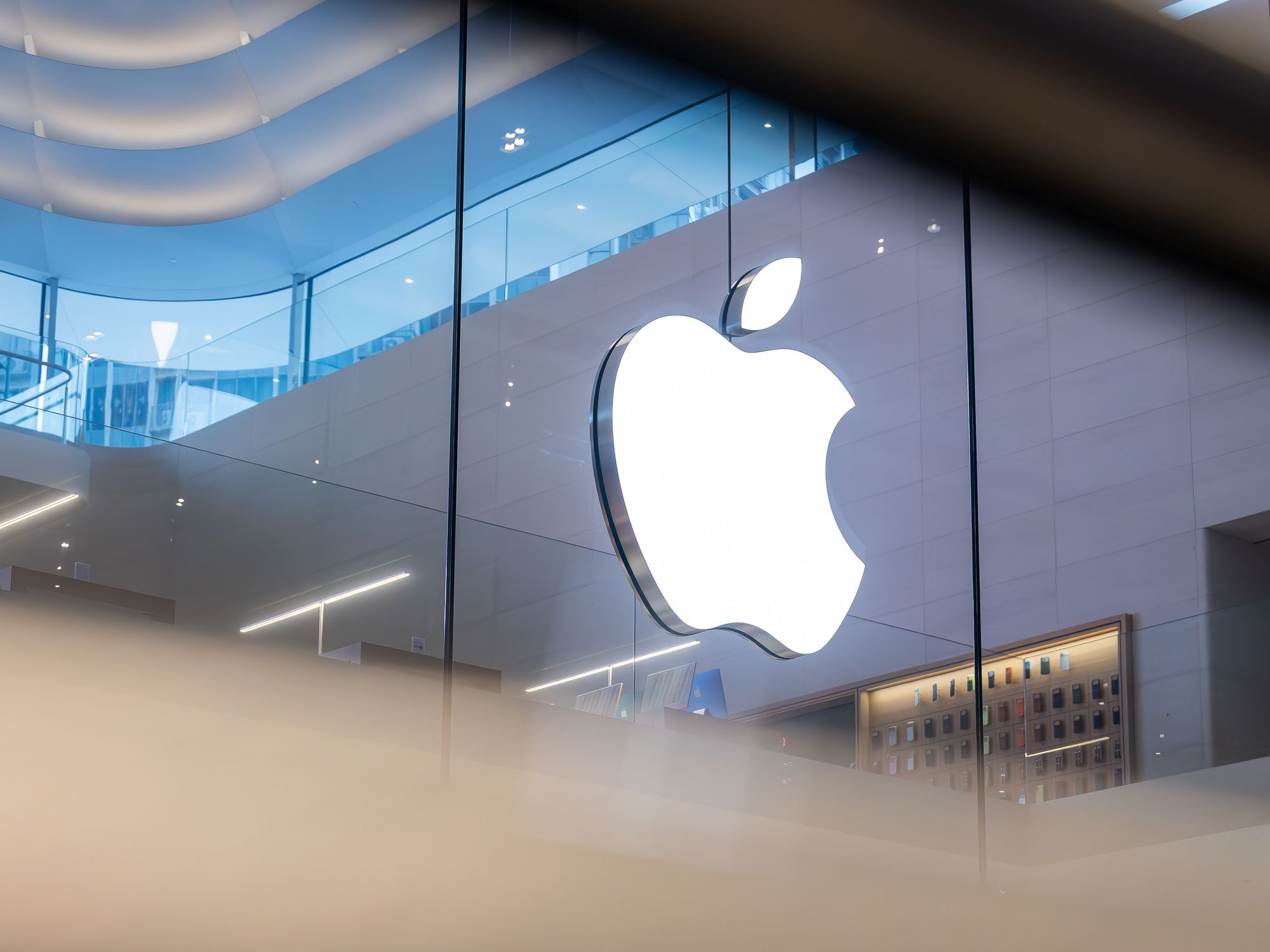 apple logo pictured inside an Apple Store
