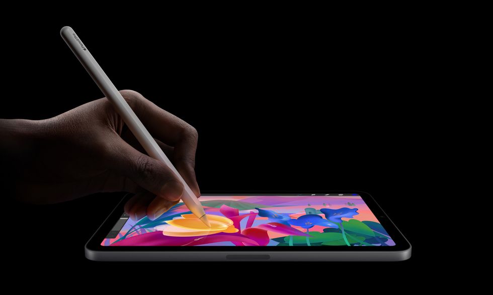 apple pencil pro being used to draw on-screen of the ipad mini