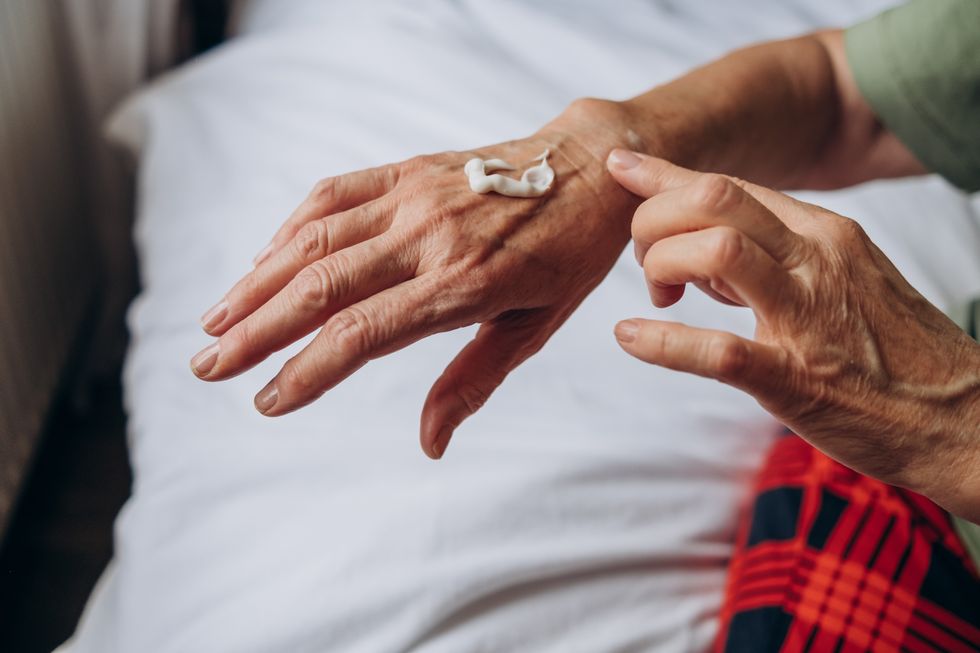 applying cream to hand