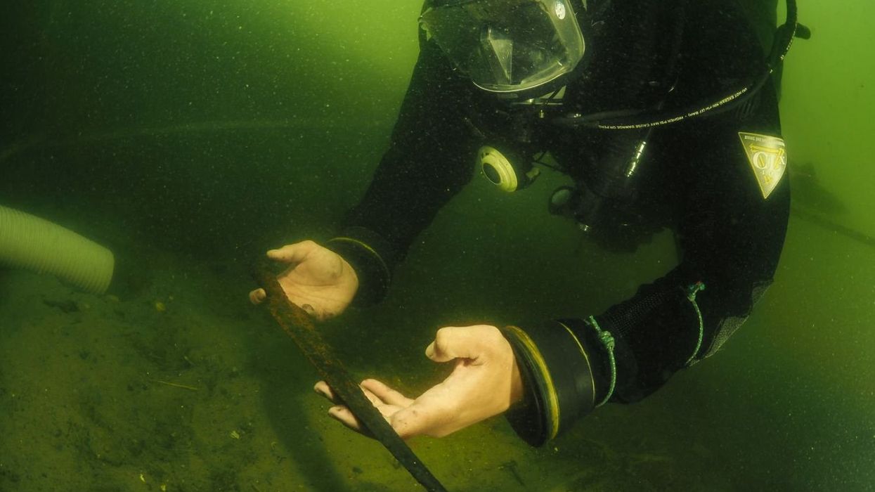 Archaeologist discovering a spear