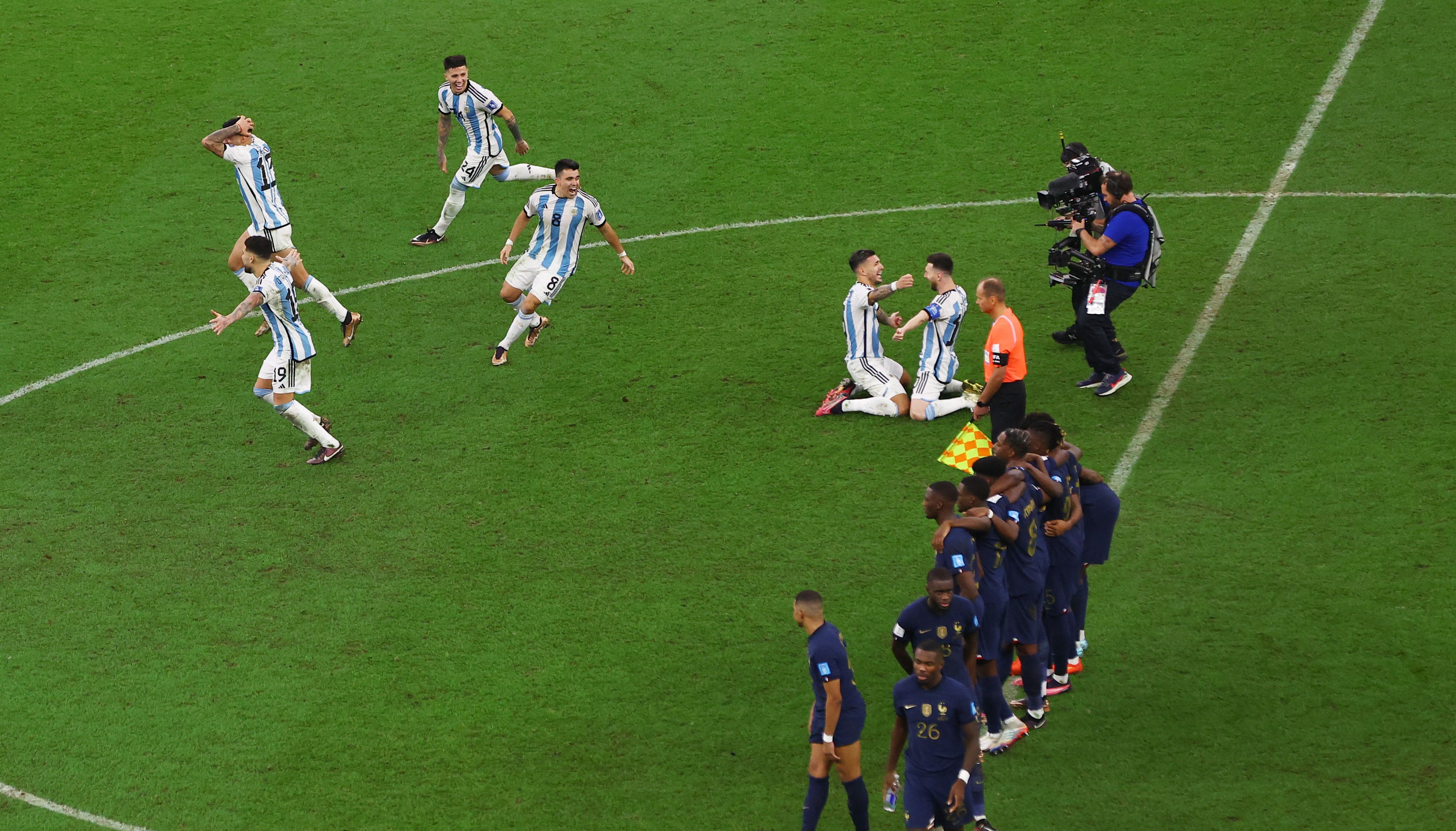 Argentina players celebrate their World Cup final penalty shootout success.