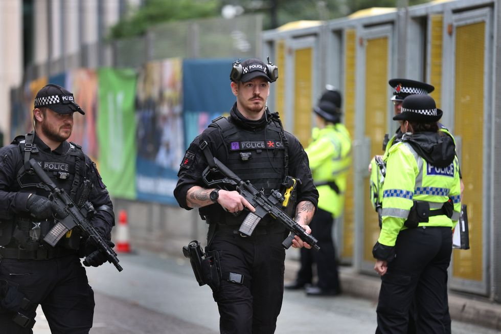 Armed GMP officers