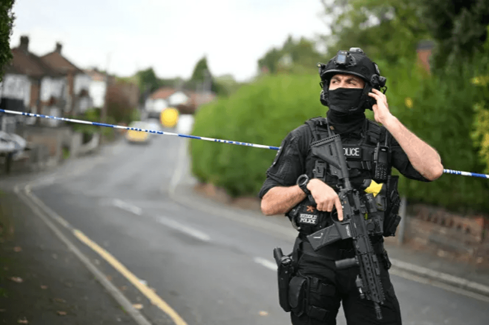 Armed officer after the Heaton Park synagogue attack in Manchester in October