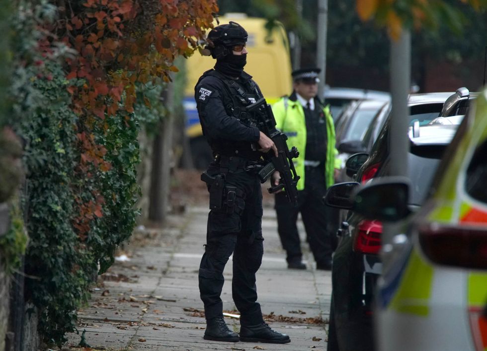 Armed police at an address in Liverpool after an explosion at Liverpool Womens Hospital killed one person and injured another.