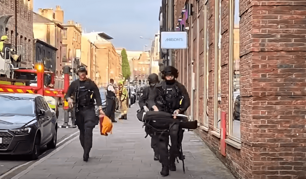 Armed police carrying guns in Liverpool