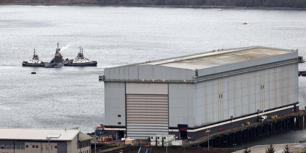 Iranian man and Romanian woman charged after trying to enter British nuclear base Iranian man and Romanian woman charged after trying to enter British nuclear base