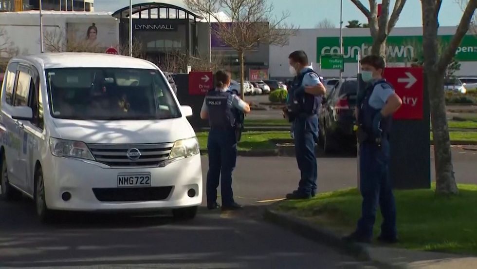 Armed police standing by at the close to where the attack took place.