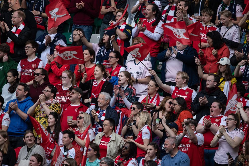 Arsenal fans are in the stands during the UEFA Women's Champions League semi-final first leg match at The Volkswagen Arena, Wolfsburg