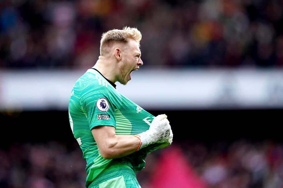 Arsenal goalkeeper Aaron Ramsdale celebrates their side's first goal, scored by team-mate Bukayo Saka during the Premier League match at the Emirates Stadium.