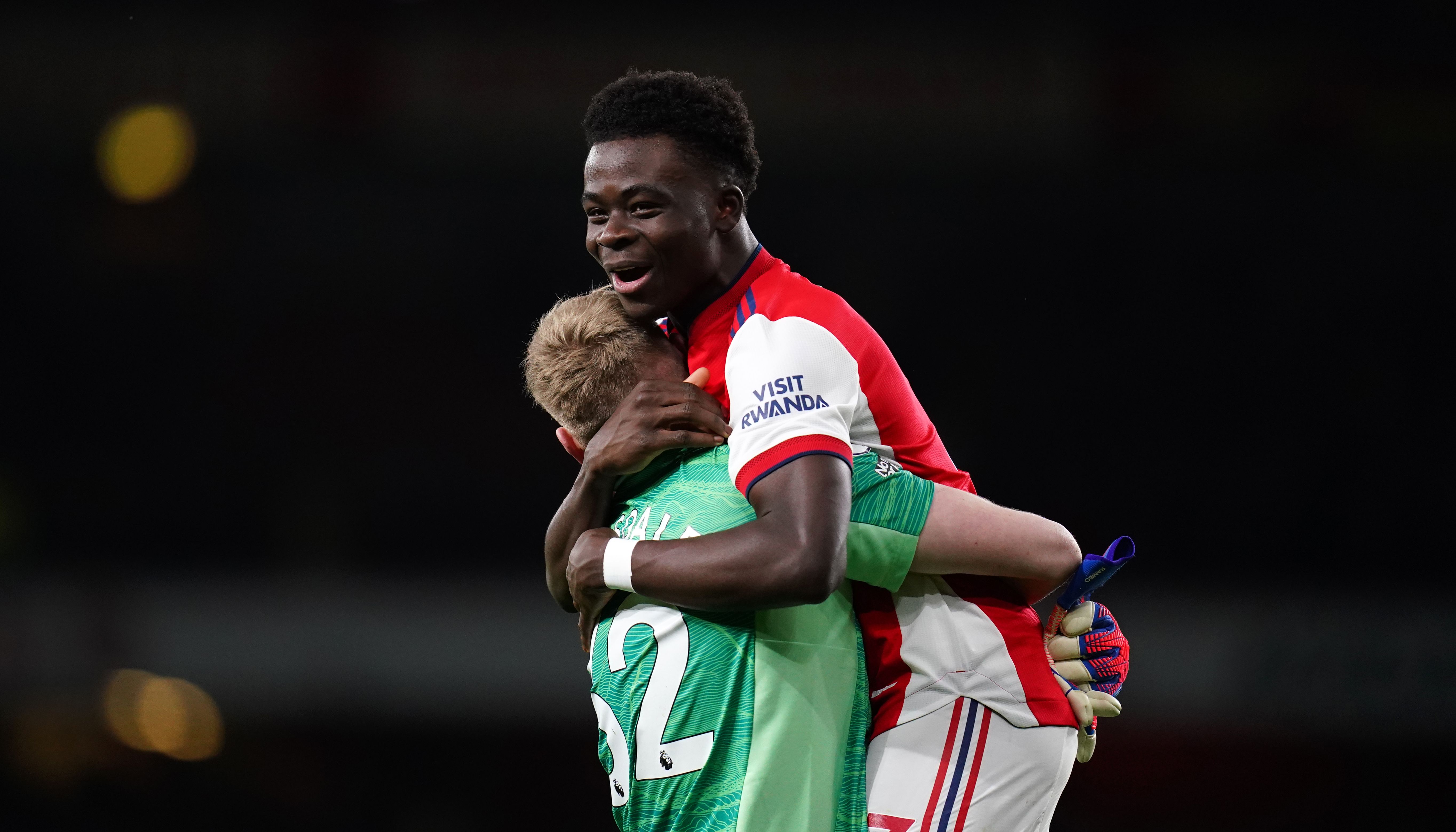 Arsenal goalkeeper Aaron Ramsdale (left) and Bukayo Saka celebrate after the final whistle following the Premier League match at Emirates Stadium, London. Picture date: Thursday February 24, 2022.
