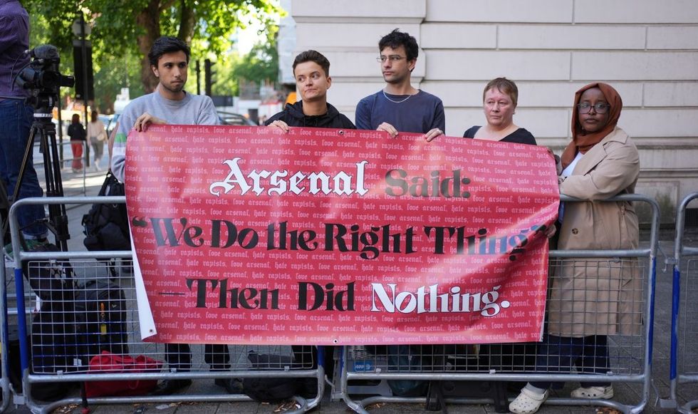 Arsenal Supporters Against Sexual Violence members protested outside court at the midfielder's last appearance