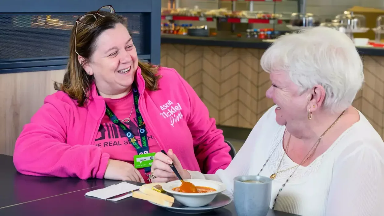 Asda worker enjoying a meal with over 60s shopper