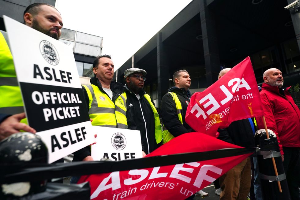 Aslef General Secretary Mick Whelan (right) at a picket line at Euston station in London, as members of the drivers' union Aslef and the Transport Salaried Staffs Association (TSSA) go on strike. Picture date: Wednesday October 5, 2022.