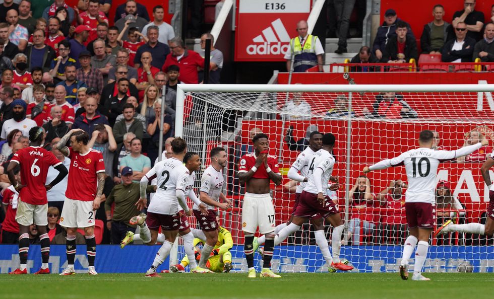 Aston Villa's Kortney Hause (third right) celebrates with his team mates after scoring the first goal of the game during the Premier League match at Old Trafford, Manchester.