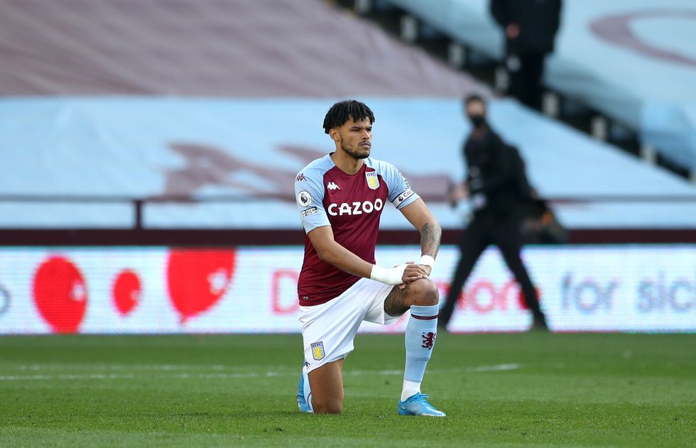 Aston Villa's Tyrone Mings takes a knee prior to the Premier League match at Villa Park, Birmingham. Picture date: Sunday April 4, 2021.