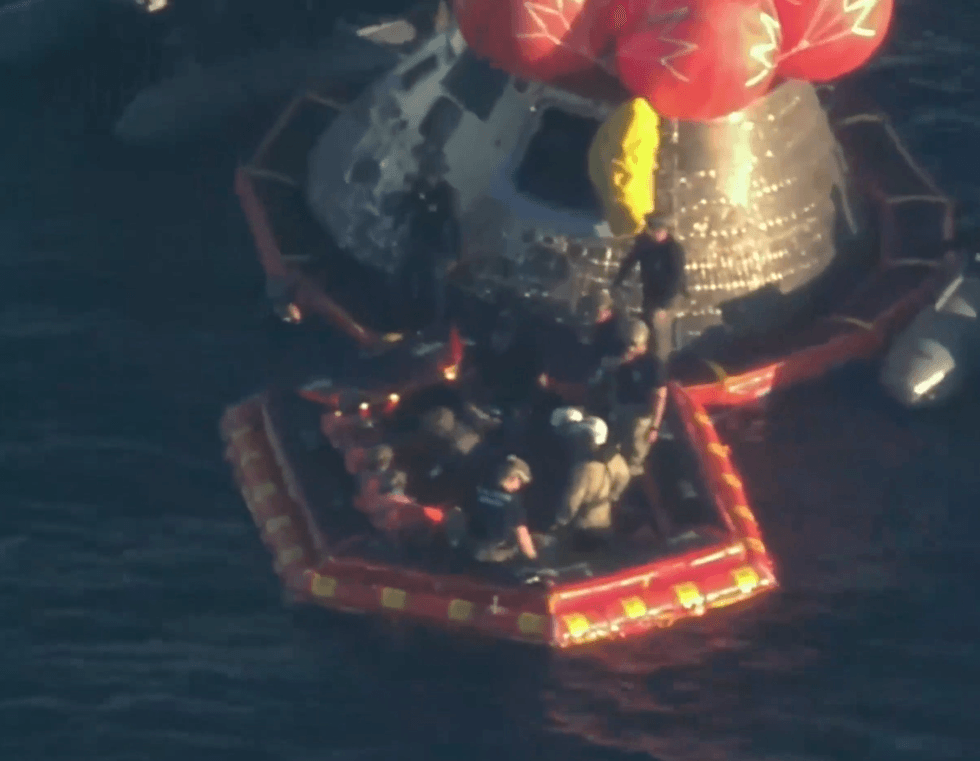 Astronauts in capsule