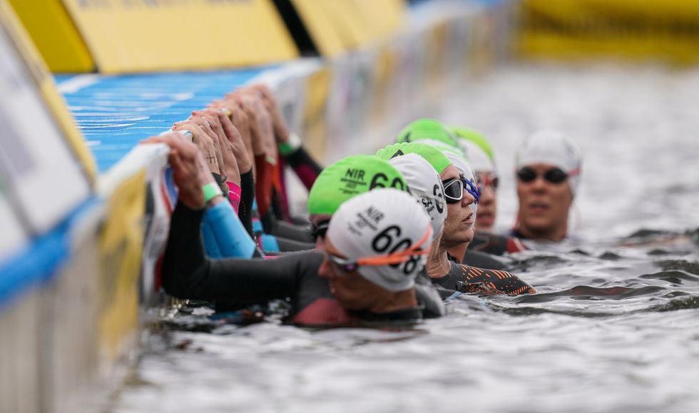 Athletes prepare for the start of the swim in the Womens Para Triathlon on day three of the 2022 Commonwealth Games in Birmingham. Picture date: Sunday July 31, 2022.