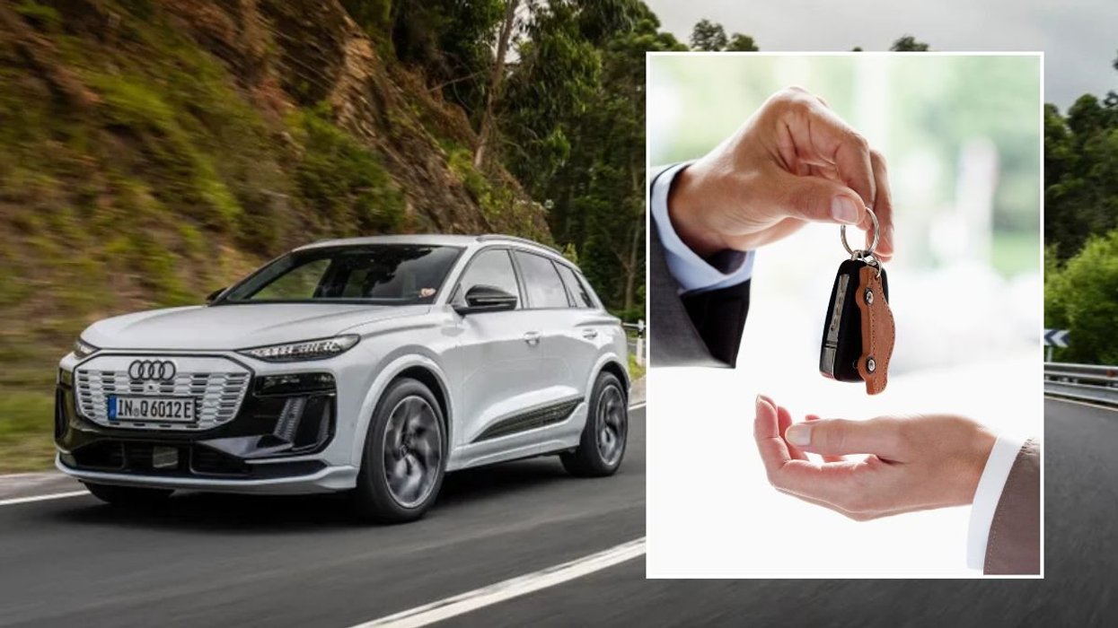 Audi Q6 e-tron and a man handing over car keys