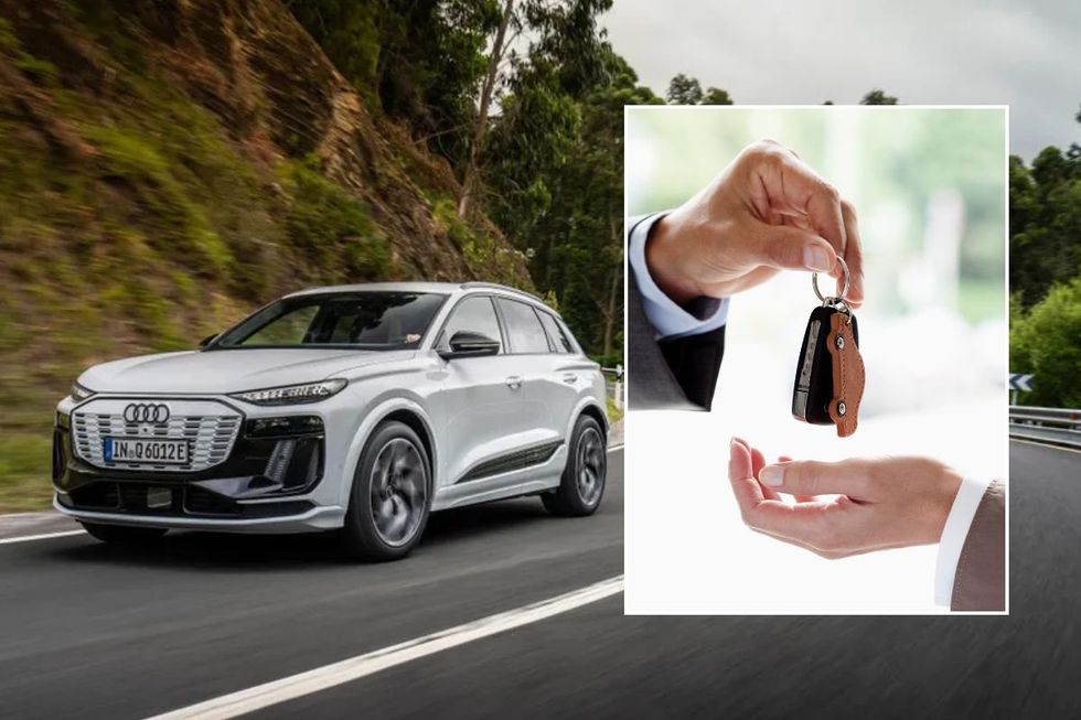 Audi Q6 e-tron and a man handing over car keys