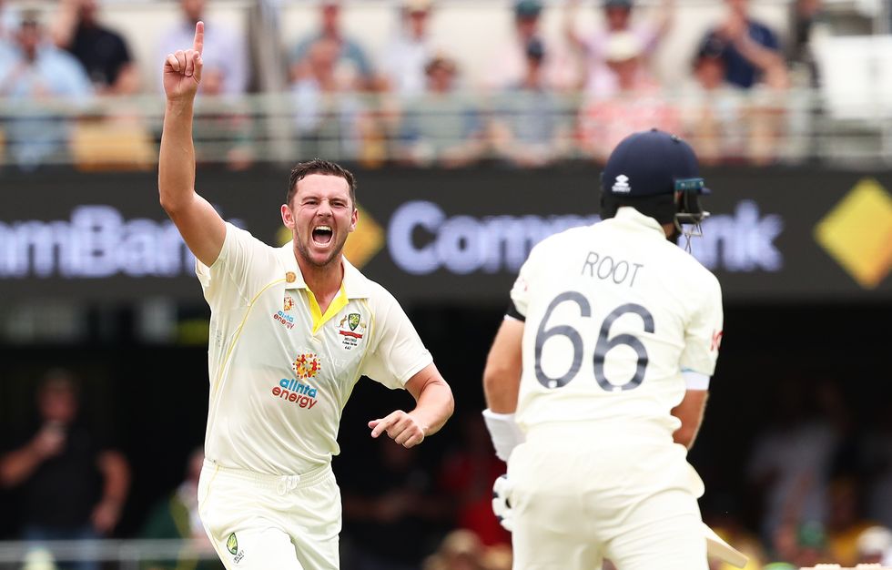 Australia's Josh Hazlewood celebrates the wicket of England's Joe Root during day one of the first Ashes test at The Gabba, Brisbane.