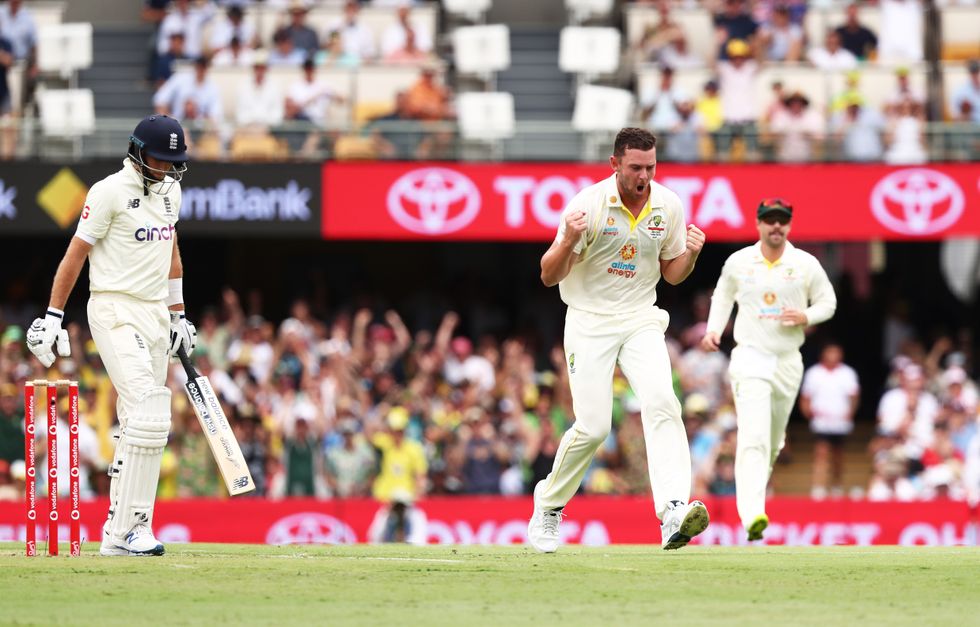 Australia's Josh Hazlewood celebrates the wicket of England's Joe Root during day one of the first Ashes test at The Gabba, Brisbane.