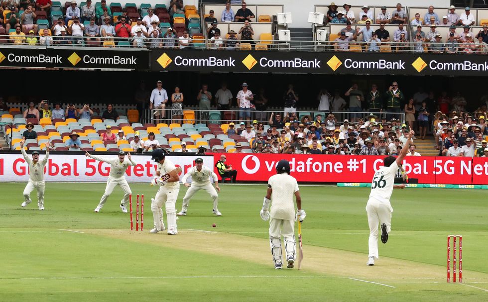 Australia's Mitchell Starc takes the wicket of England's Rory Burns on the first ball of The Ashes Series during day one of the first Ashes test at The Gabba, Brisbane.