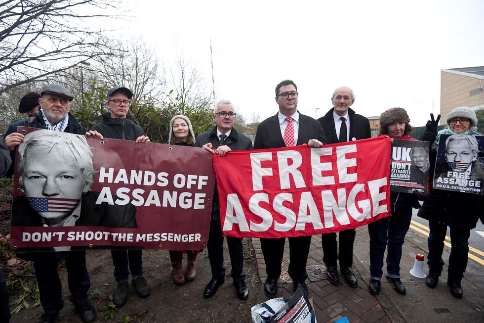 Australian MPs Andrew Wilkie (centre) and George Christensen (fourth right), with John Shipton, (third right), the father of WikiLeaks founder Julian Assange, outside Belmarsh prison.