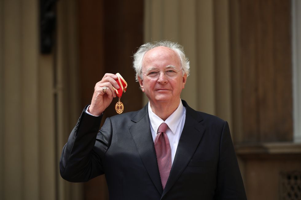 Author Philip Pullman with his knighthood following an investiture ceremony at Buckingham Palace, London.