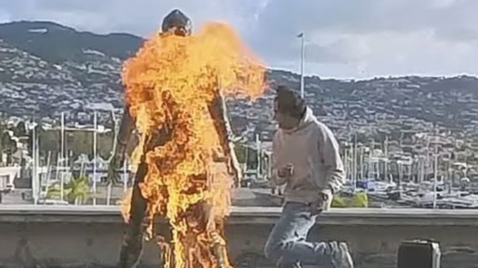Authorities in Madeira are searching for a young man who set fire to a bronze statue of Cristiano Ronaldo outside the CR7 Museum in Funchal on Tuesday morning